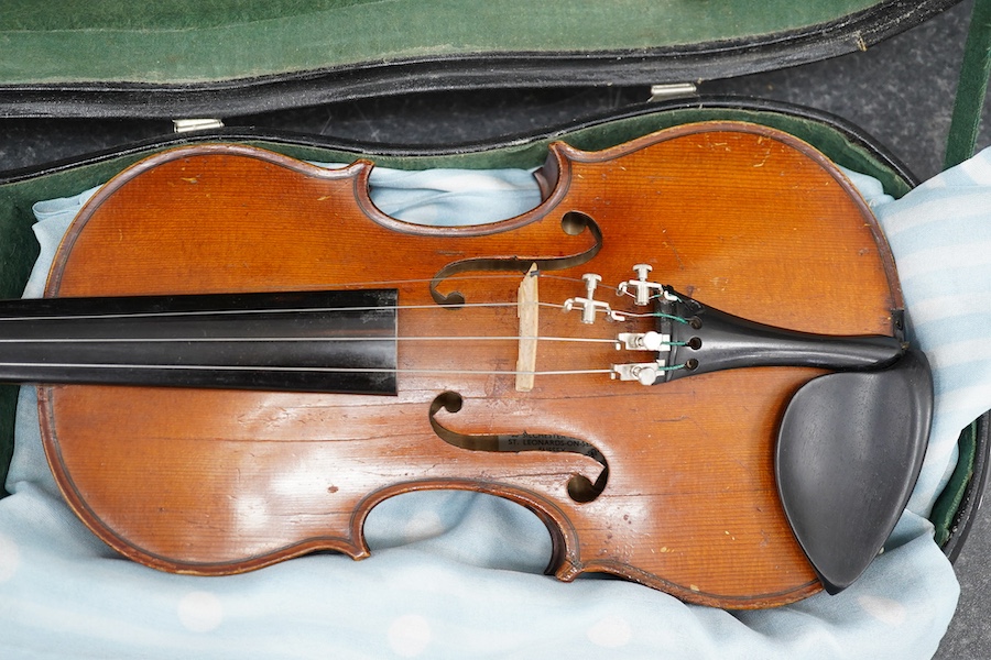 Three violins; a 3/4 Czech, a 1/2 size German and a 1/4 size Czech, all cased. Condition - fair to good